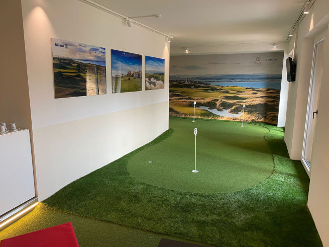 Detroit and all of Michigan indoor putting green in an office with scenic wall art